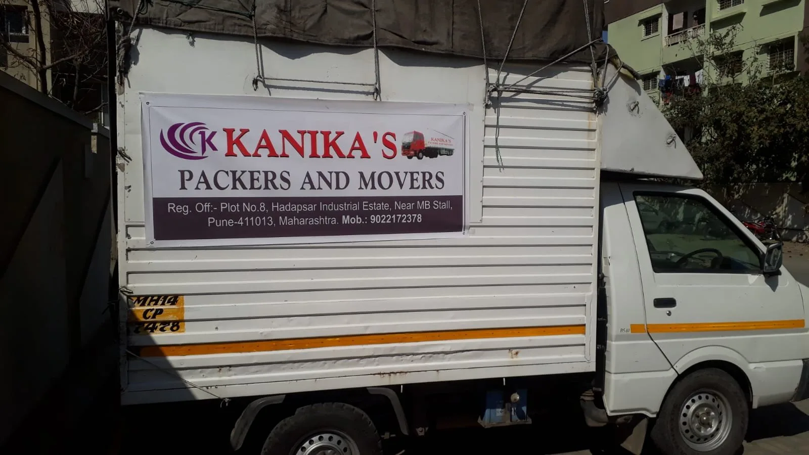 Kanika's Packers and Movers truck outside the Hadapsar office